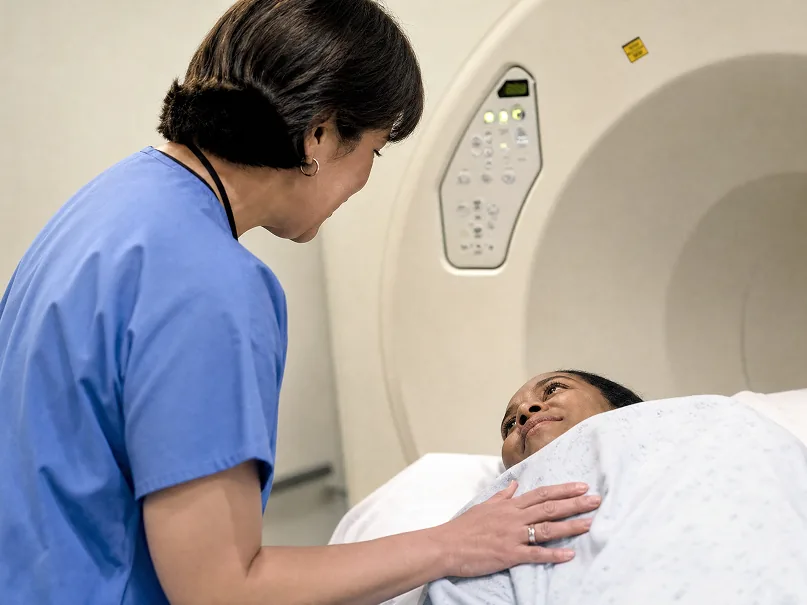 A Lucent technologist reassuring a patient before an MRI scan in Glendale